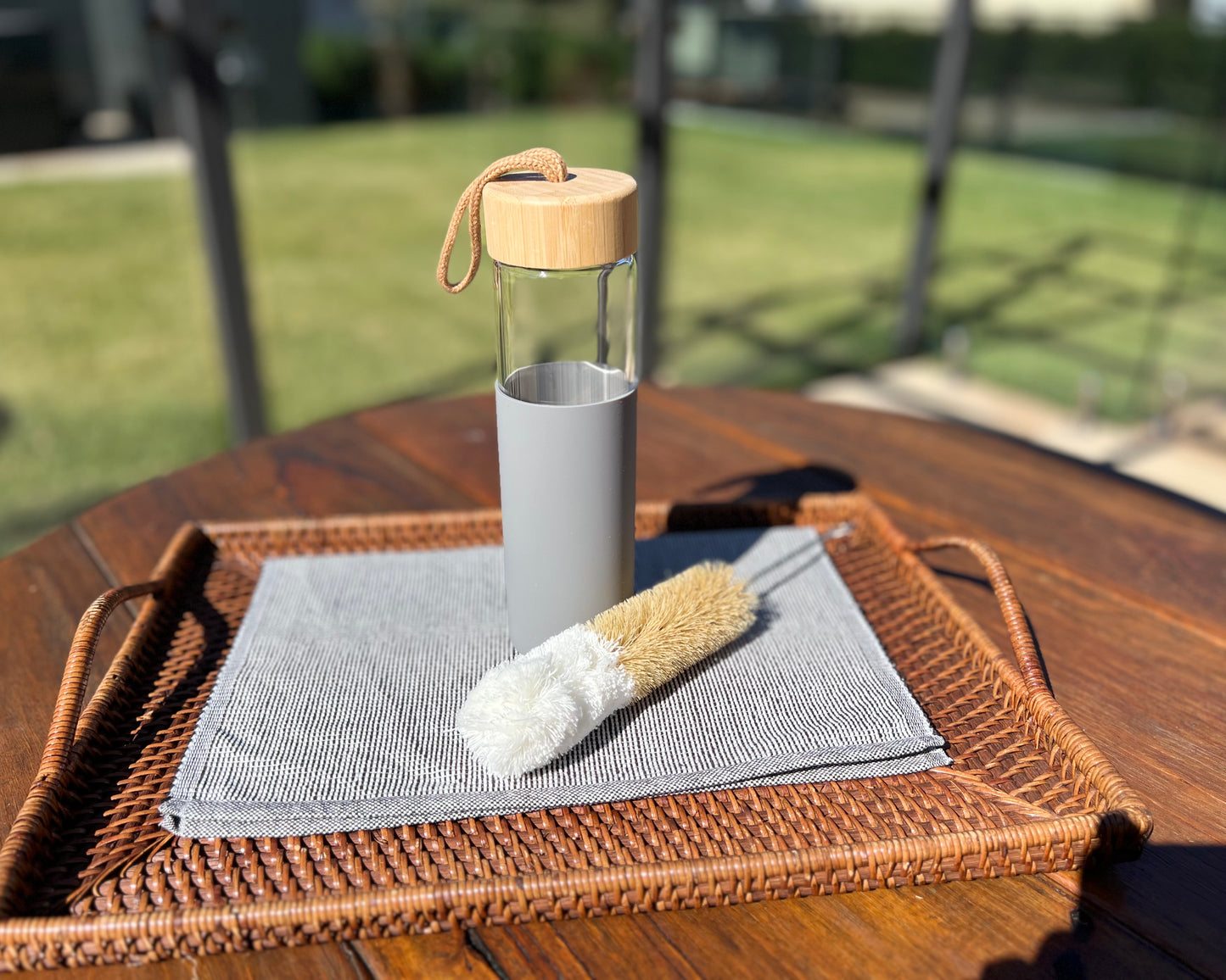 Glass water bottle with bottle brush